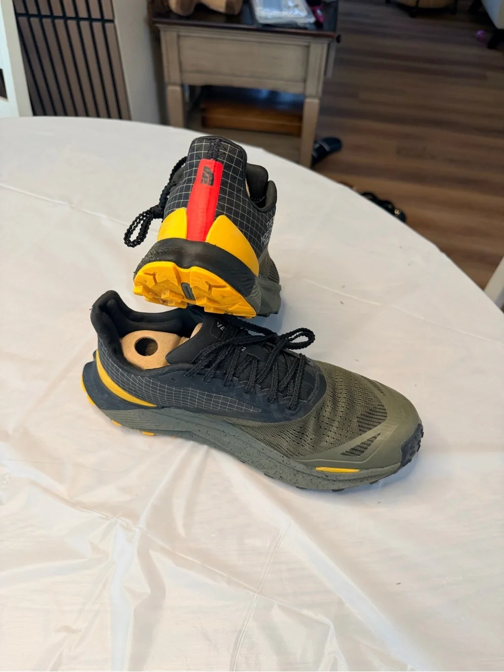 The North Face Men's Black and Olive Trail Shoes with Yellow and Red Accents